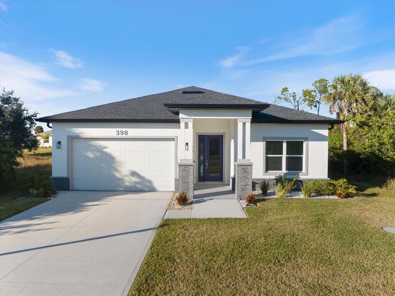 Front exterior of a new home in , Rotonda West, FL, highlighting curb appeal (Image 1).