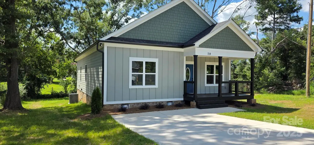 Front exterior of a new home in , Gastonia, NC, highlighting curb appeal (Image 1).