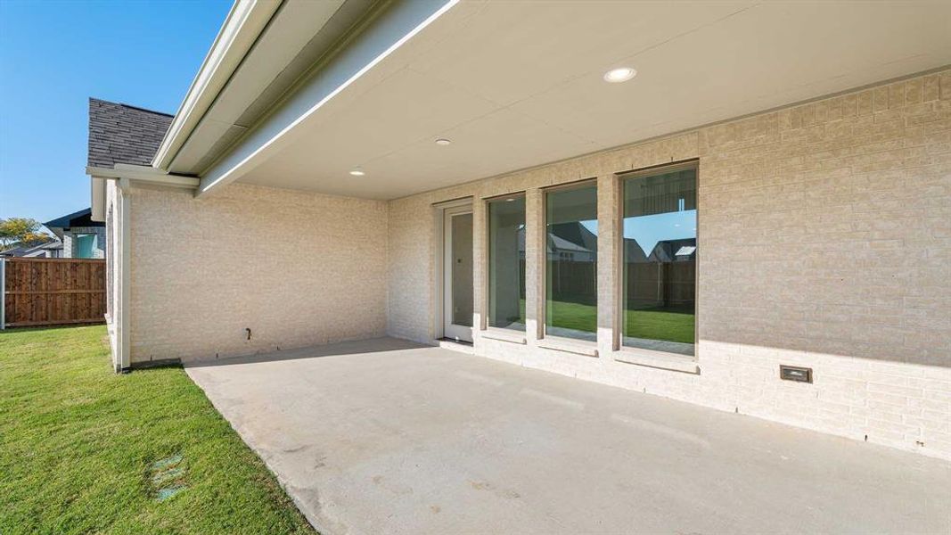 Exterior details and patio area of a home in Trinity Falls 50', McKinney (Image 3).