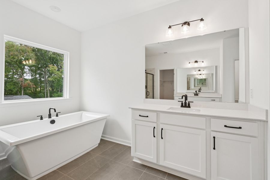 Representative furnished interior of a home built from the Macon by Ashton Woods in Rowland's Grant, Fuquay Varina (Image 29).