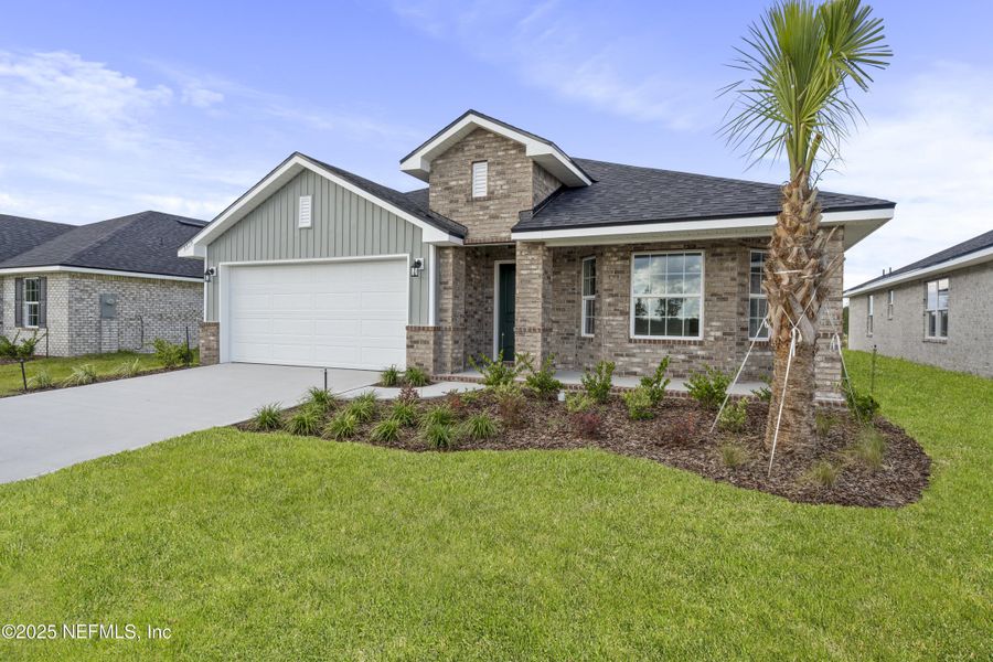 Front exterior of a new home in Shadow Crest at Rolling Hills, Green Cove Springs, FL, highlighting curb appeal (Image 1). Front exterior of a new home in Shadow Crest at Rolling Hills, Green Cove Springs, FL, highlighting curb appeal (Image 1).
