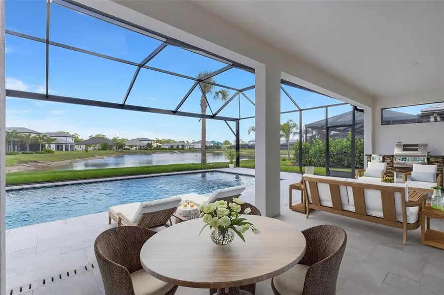 Exterior details and patio area of a home in Cassata Lakes, Nokomis (Image 3).