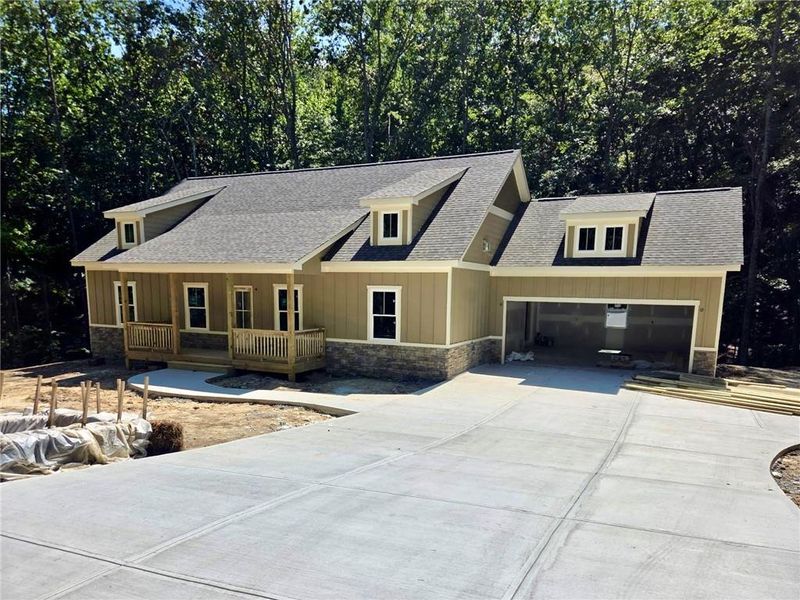 Front exterior of a new home in , Waleska, GA, highlighting curb appeal (Image 1). Front exterior of a new home in , Waleska, GA, highlighting curb appeal (Image 1).