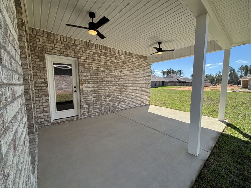 Exterior details and patio area of a home in Bird Song at Hammock Bay, Freeport (Image 4).