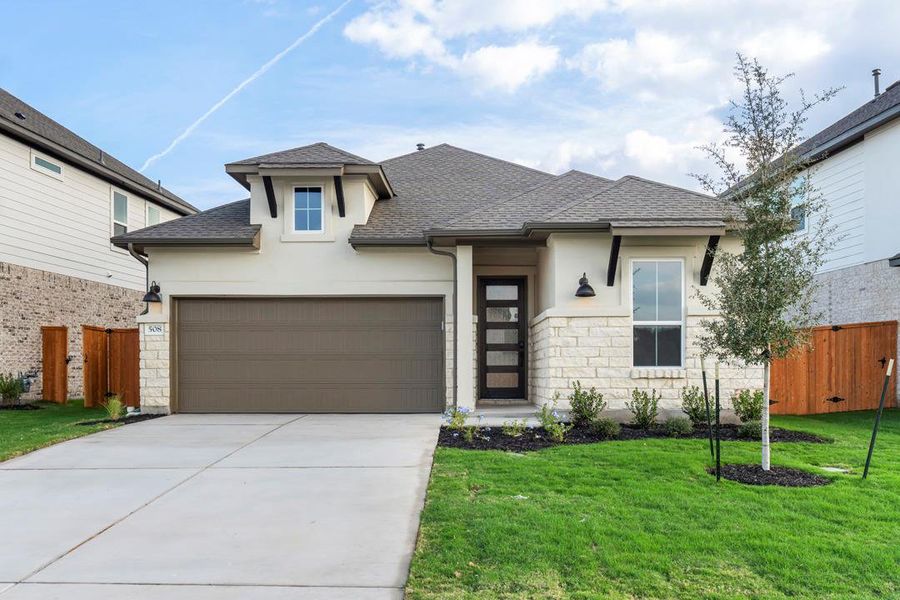 Front exterior of a new home in Lariat, Liberty Hill, TX, highlighting curb appeal (Image 2). Front exterior of a new home in Lariat, Liberty Hill, TX, highlighting curb appeal (Image 2).