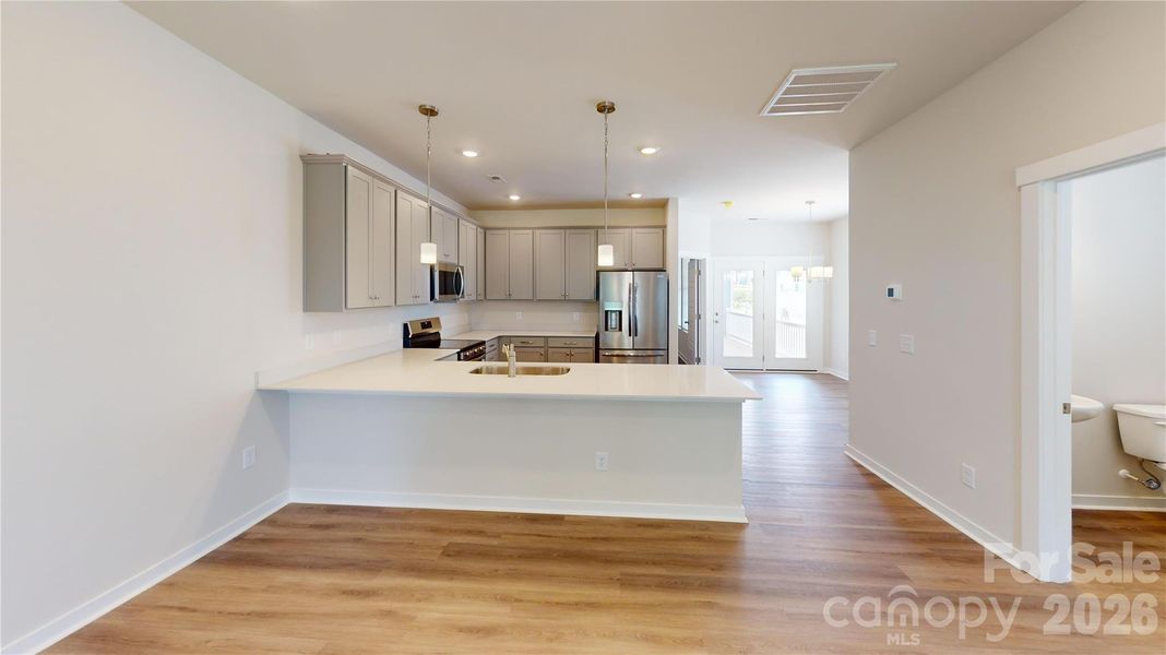 All photos representative of the Tinkham floorplan at Vanguard in Vermillion.