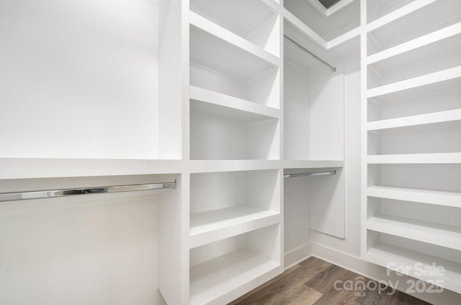 Bedroom closets have wooden shelves Bedroom closets have wooden shelves
