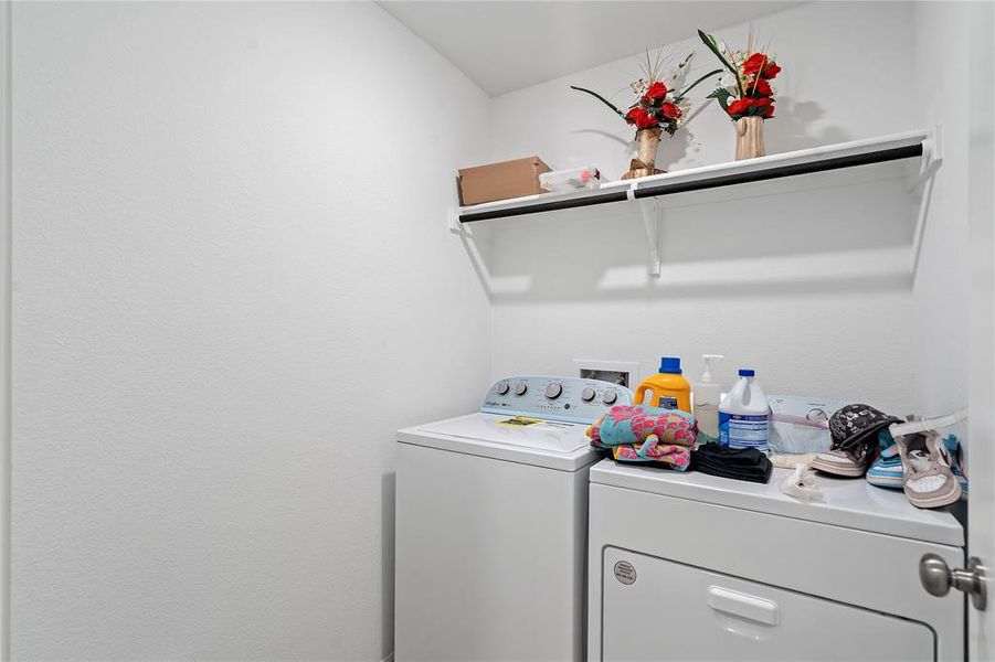 Laundry area with washer and clothes dryer