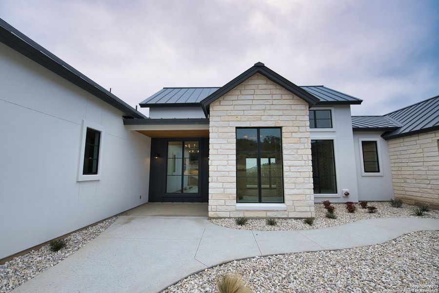 Front exterior of a new home in , San Antonio, TX, highlighting curb appeal (Image 18). Front exterior of a new home in , San Antonio, TX, highlighting curb appeal (Image 18).