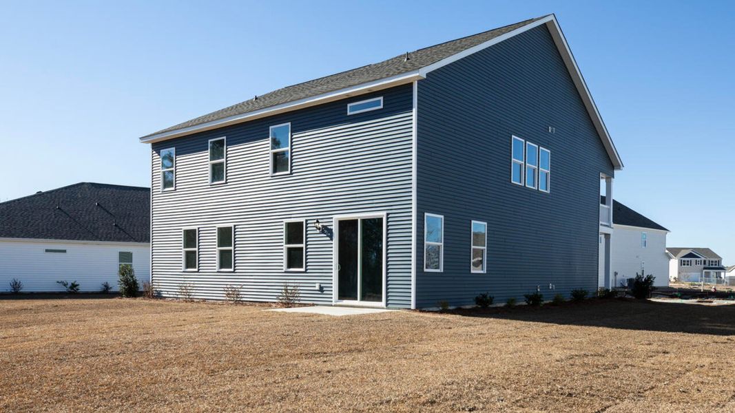Exterior details and patio area of a home in Indigo Preserve, Leland (Image 20).