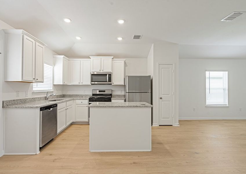 Enjoy luxury vinyl flooring in the main areas