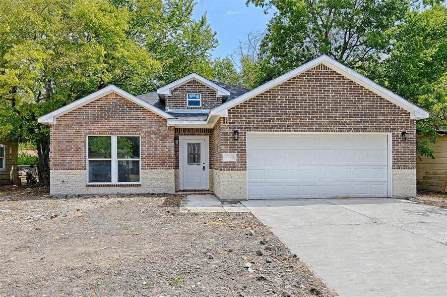 View of property featuring a garage