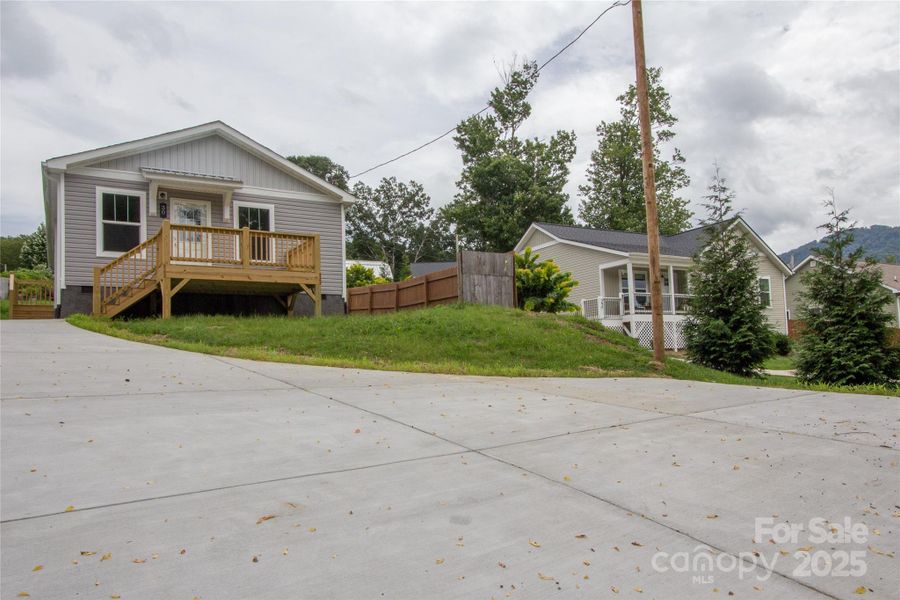 New concrete driveway & parking pad below New concrete driveway & parking pad below