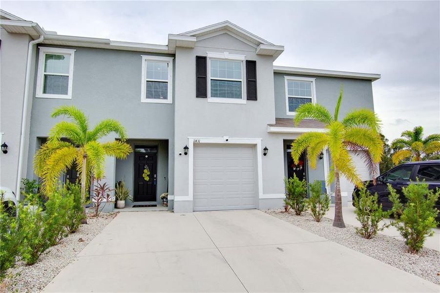 Front exterior of a new home in , Bradenton, FL, highlighting curb appeal (Image 20).