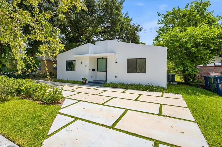 Front exterior of a new home in , South Miami, FL, highlighting curb appeal (Image 19). Front exterior of a new home in , South Miami, FL, highlighting curb appeal (Image 19).