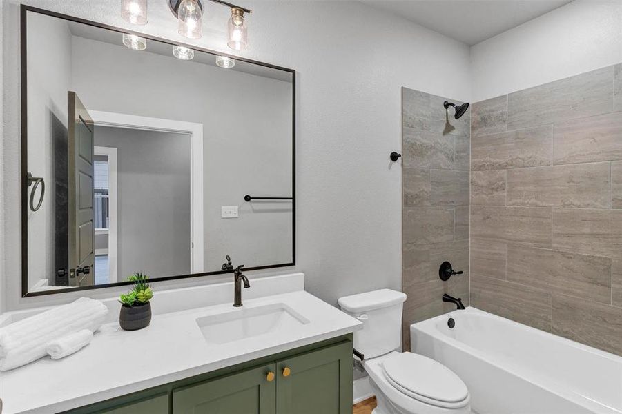 Bathroom featuring vanity and tub / shower combination
