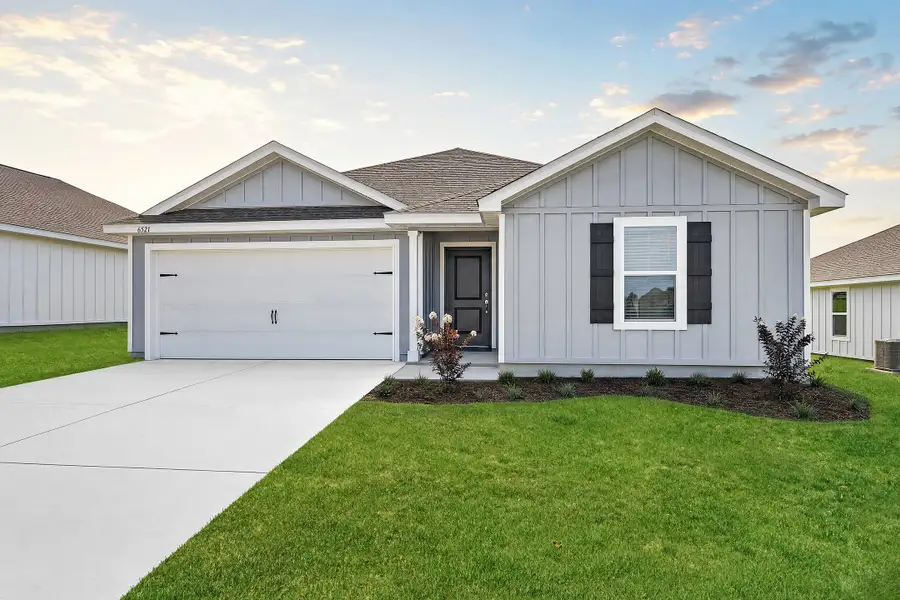 Front exterior of a new home in Stonechase: Classics, Pace, FL, highlighting curb appeal (Image 1). Front exterior of a new home in Stonechase: Classics, Pace, FL, highlighting curb appeal (Image 1).