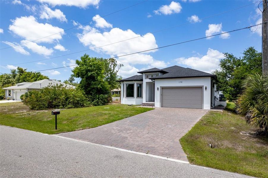 Front exterior of a new home in , Rotonda West, FL, highlighting curb appeal (Image 25).