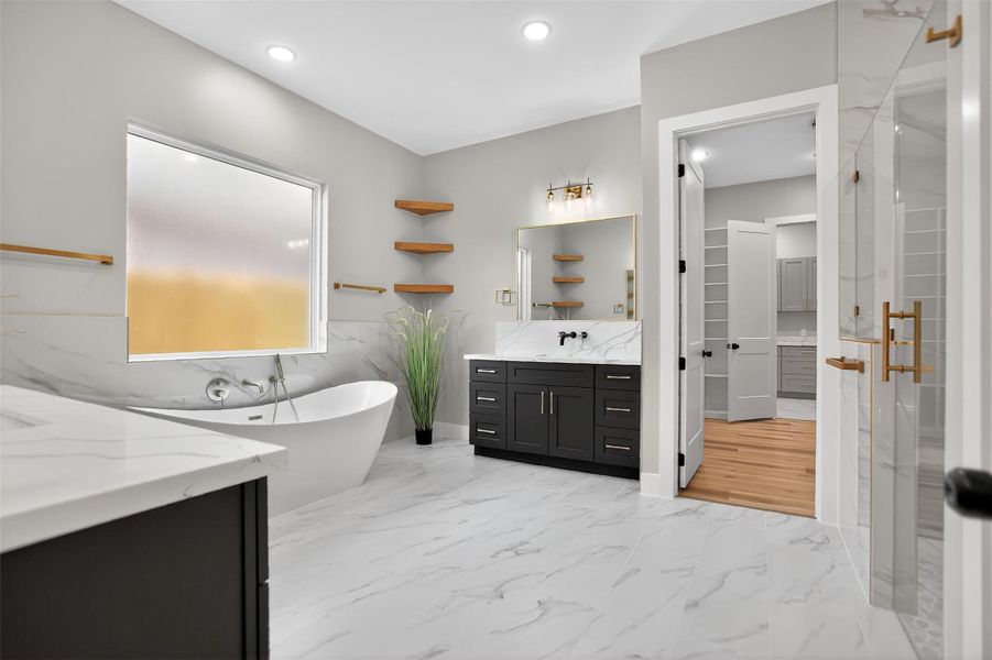 Relax in the owner’s retreat spa-like bathroom with soaking tub, large walk-in shower and double vanities.