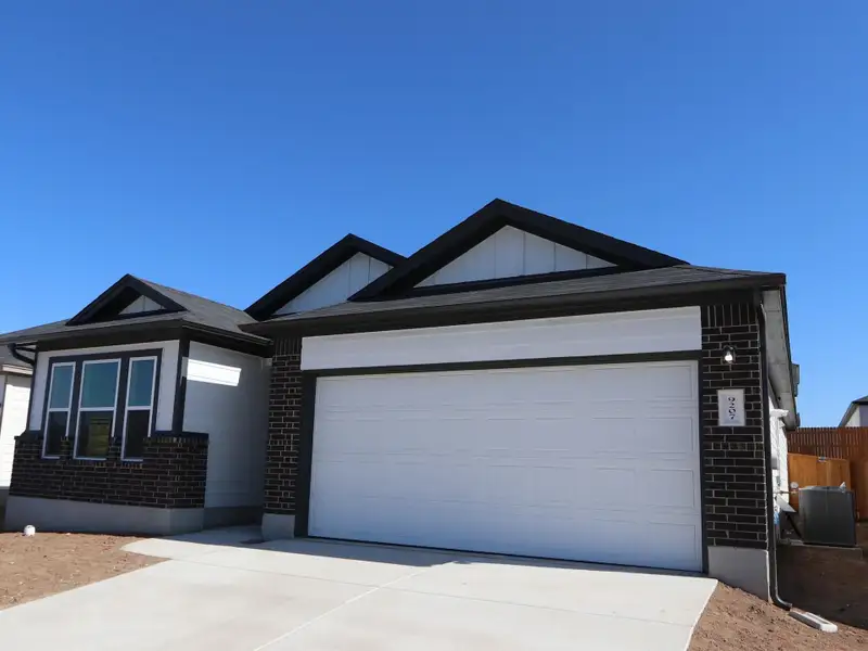 Front exterior of a new home in Marble Creek Crossing, Austin, TX, highlighting curb appeal (Image 1).