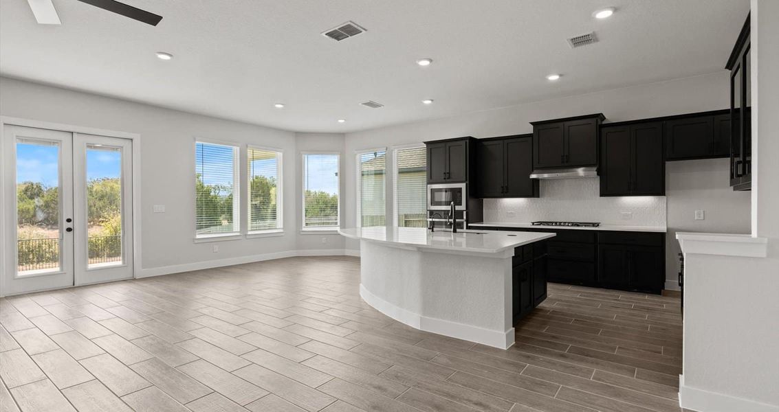 Furnished interior view inside a new home in Village at Three Oaks, Seguin (Image 7).