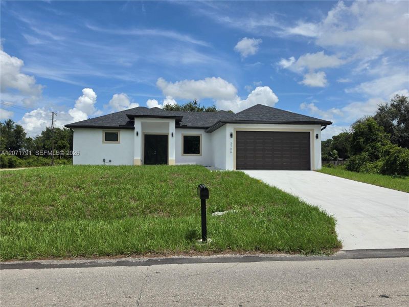 Front exterior of a new home in , Lehigh Acres, FL, highlighting curb appeal (Image 18).