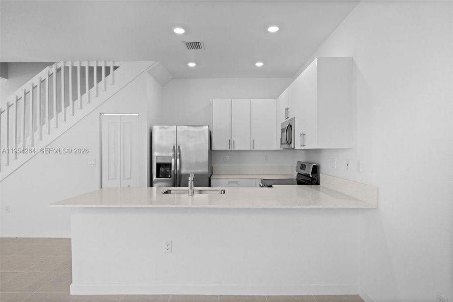 Furnished interior view inside a new home in , Homestead (Image 5). Furnished interior view inside a new home in , Homestead (Image 5).