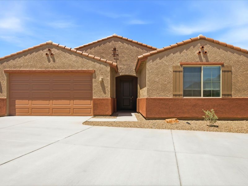 Front exterior of a new home in Naranja Trails, Oro Valley, AZ, highlighting curb appeal (Image 1). Front exterior of a new home in Naranja Trails, Oro Valley, AZ, highlighting curb appeal (Image 1).