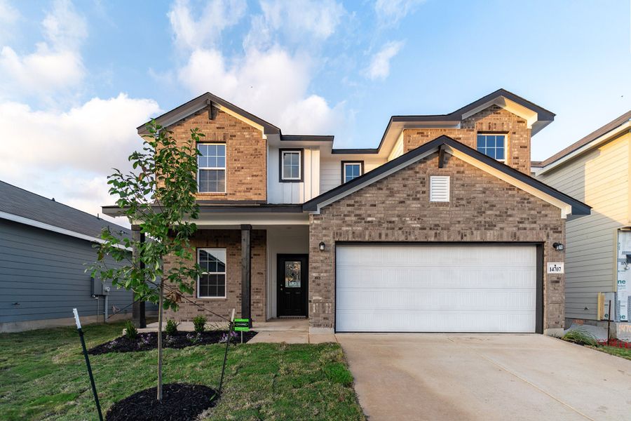 Front exterior of a new home in Hennersby Hollow, San Antonio, TX, highlighting curb appeal (Image 1). Front exterior of a new home in Hennersby Hollow, San Antonio, TX, highlighting curb appeal (Image 1).