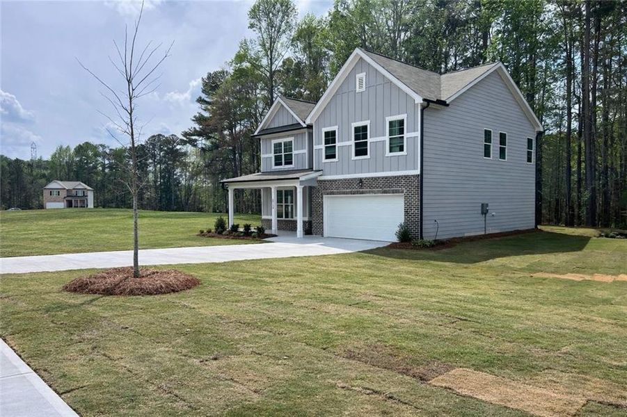 Front exterior of a new home in Whisper Creek, Atlanta, GA, highlighting curb appeal (Image 20).