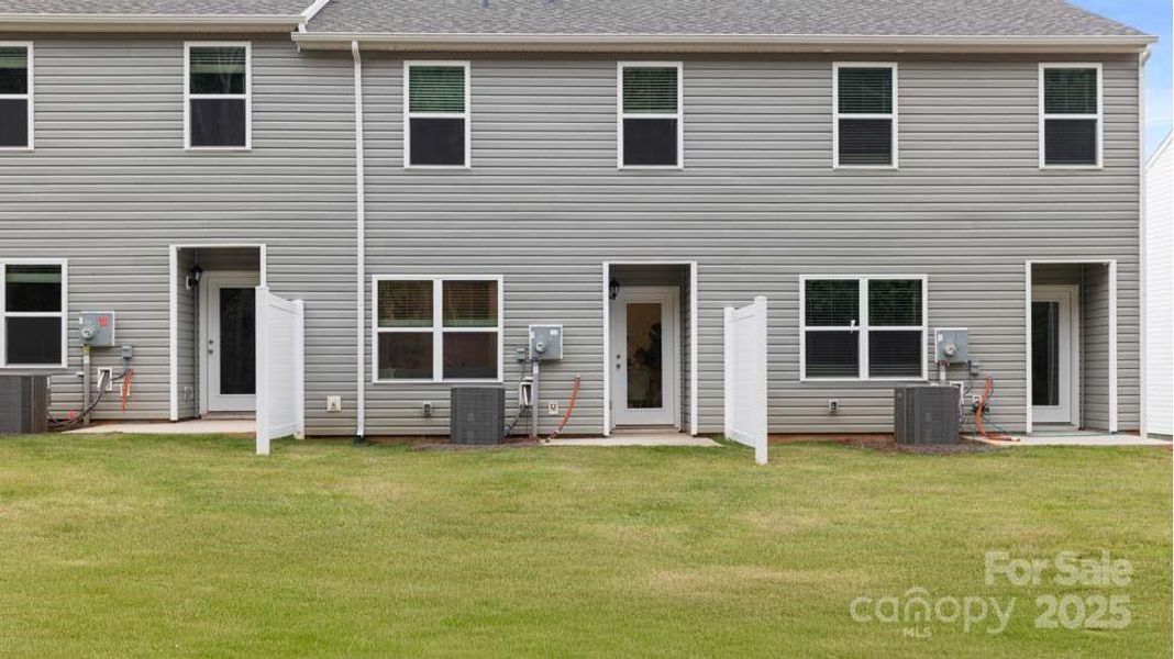 Exterior details and patio area of a home in Clark Creek Landing Townhomes, Lincolnton (Image 3).