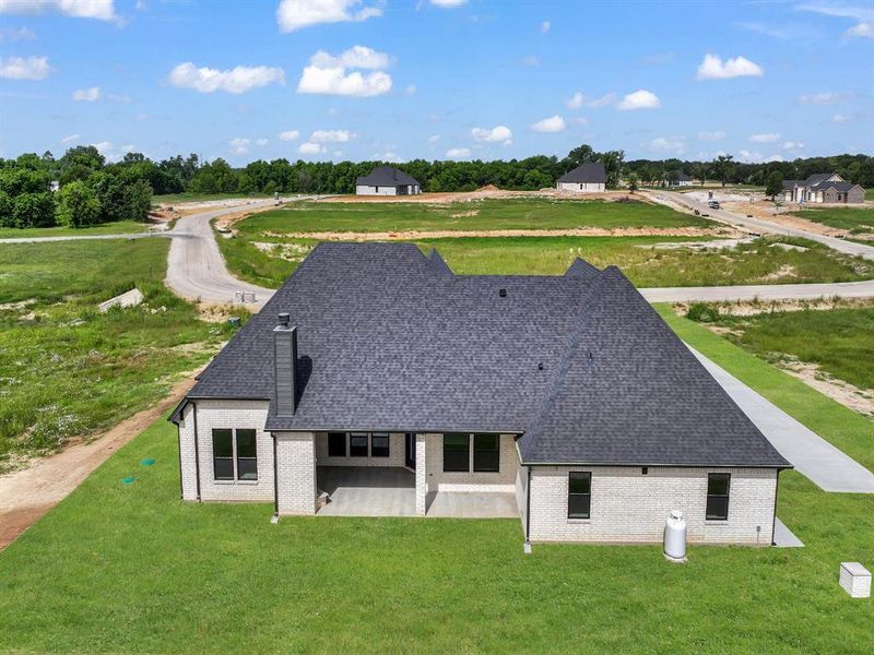 Front exterior of a new home in , Weatherford, TX, highlighting curb appeal (Image 22). Front exterior of a new home in , Weatherford, TX, highlighting curb appeal (Image 22).