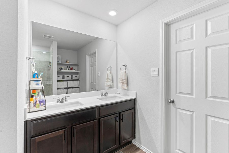 Double vanity with ample counter space and storage reflects modern bath design. Double vanity with ample counter space and storage reflects modern bath design.