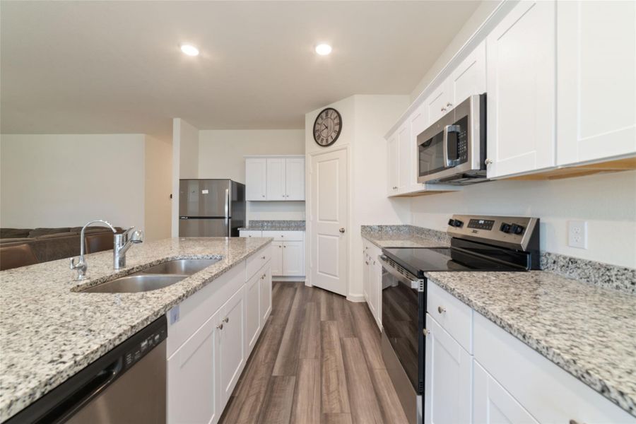 Furnished interior view inside a new home in Sunterra, Katy (Image 19).