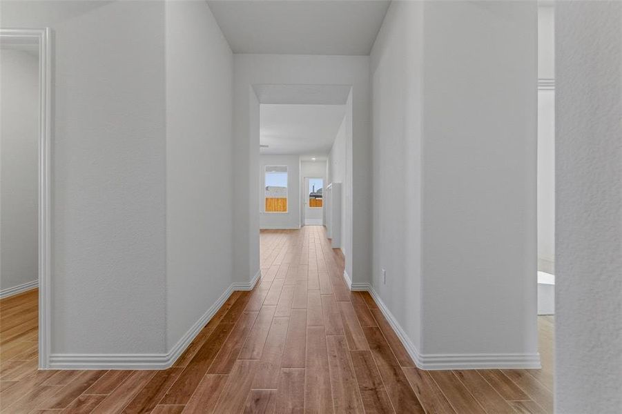 Hall with light wood-style floors