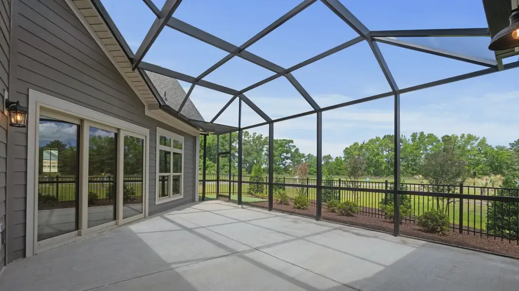 Exterior details and patio area of a home in Courtyards by Carrell, Ocean Isle Beach (Image 4). Exterior details and patio area of a home in Courtyards by Carrell, Ocean Isle Beach (Image 4).
