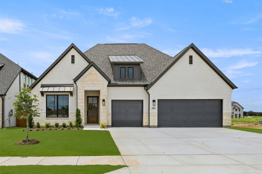 Front exterior of a new home in Rio Vista at Kelly Ranch, Aledo, TX, highlighting curb appeal (Image 1). Front exterior of a new home in Rio Vista at Kelly Ranch, Aledo, TX, highlighting curb appeal (Image 1).