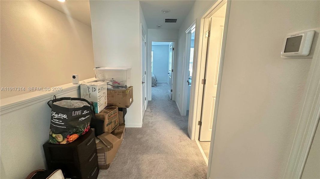 Furnished interior view inside a new home in The Townhomes at Bellalago, Kissimmee (Image 10).