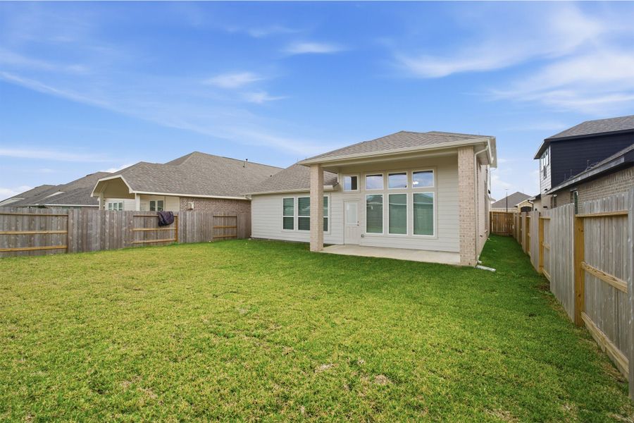 Exterior details and patio area of a home in Windrose Green, Angleton (Image 3).
