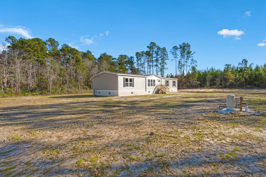 Exterior details and patio area of a home in , Cottageville (Image 23).
