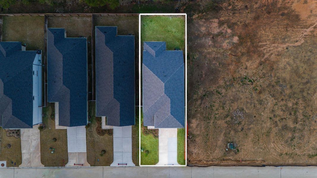 This home sits on a large lot with ample yard space in front and the back, lush landscaping and well-maintained yard!