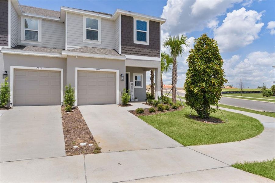 Front exterior of a new home in Waterstone, Groveland, FL, highlighting curb appeal (Image 24).