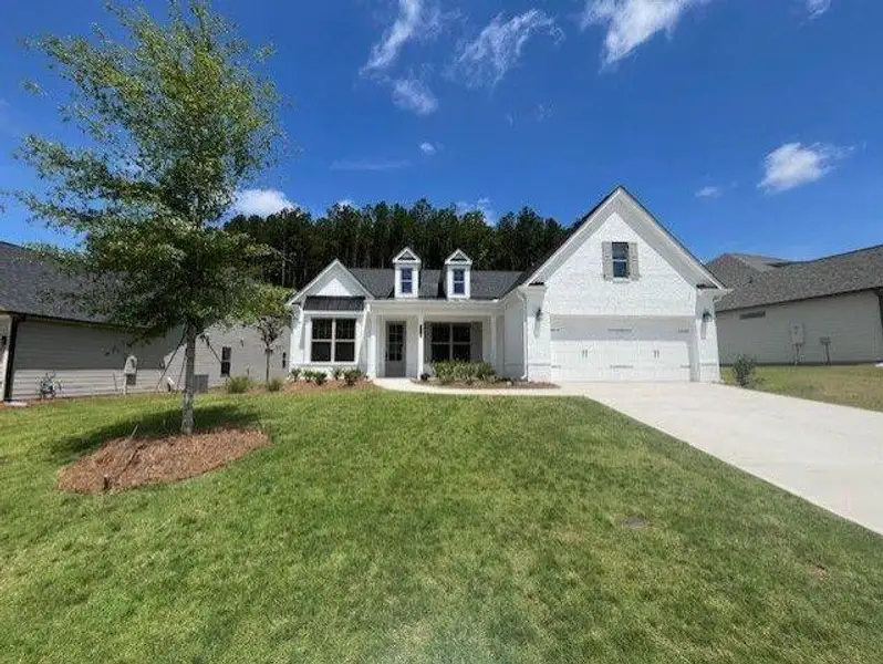 Front exterior of a new home in Soleil Belmont Park, Canton, GA, highlighting curb appeal (Image 1). Front exterior of a new home in Soleil Belmont Park, Canton, GA, highlighting curb appeal (Image 1).