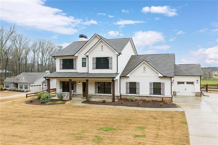 Front exterior of a new home in Alcovy Station, Covington, GA, highlighting curb appeal (Image 28).