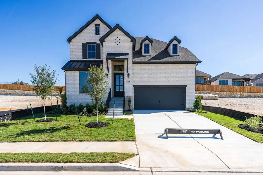 View of front of house with brick siding and driveway View of front of house with brick siding and driveway