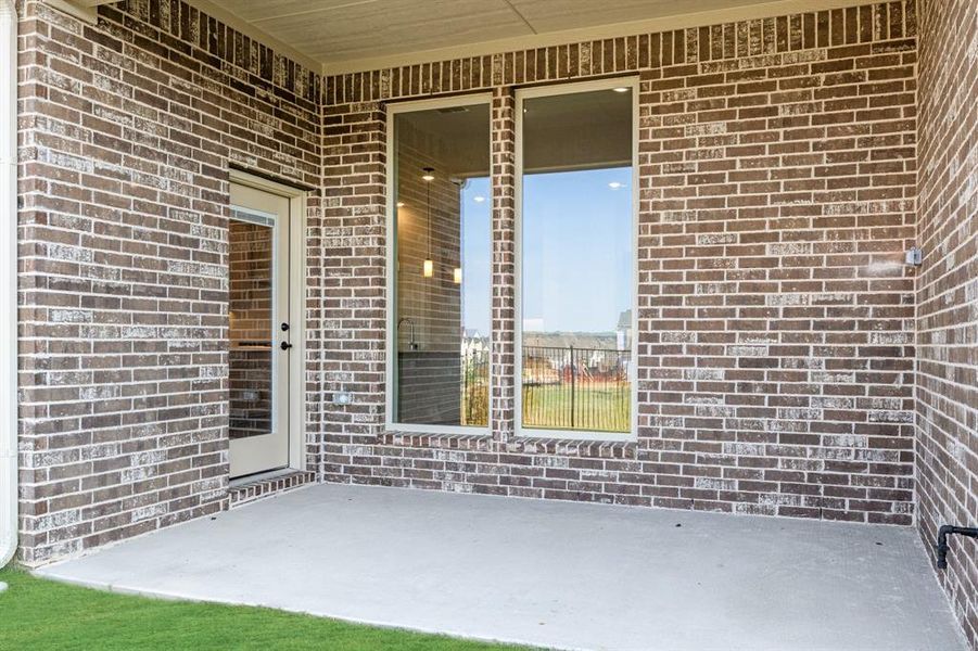 Exterior details and patio area of a home in Parks at Panchasarp Farms 55-60, Burleson (Image 22).
