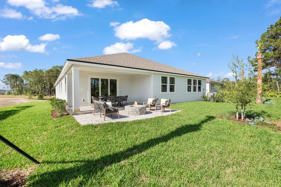 Kenai Model Home Backyard with Firepit and Covered Patio at Reserve East in Flagler Beach Kenai Model Home Backyard with Firepit and Covered Patio at Reserve East in Flagler Beach