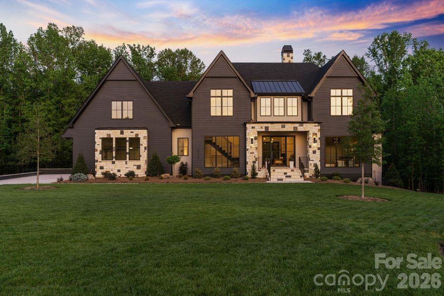 Front exterior of a new home in Cardinal Crest, Weddington, NC, highlighting curb appeal (Image 1). Front exterior of a new home in Cardinal Crest, Weddington, NC, highlighting curb appeal (Image 1).