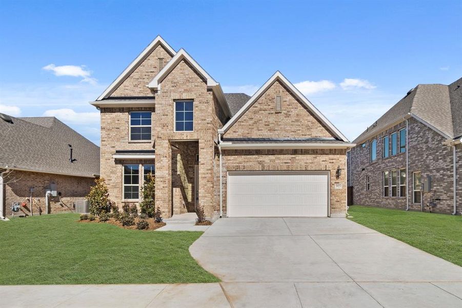 Front exterior of a new home in Lyons Crest Estates, Garland, TX, highlighting curb appeal (Image 18).