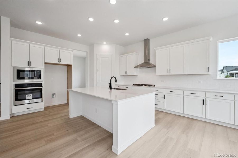 Furnished interior view inside a new home in The Aurora Highlands, Aurora (Image 9).